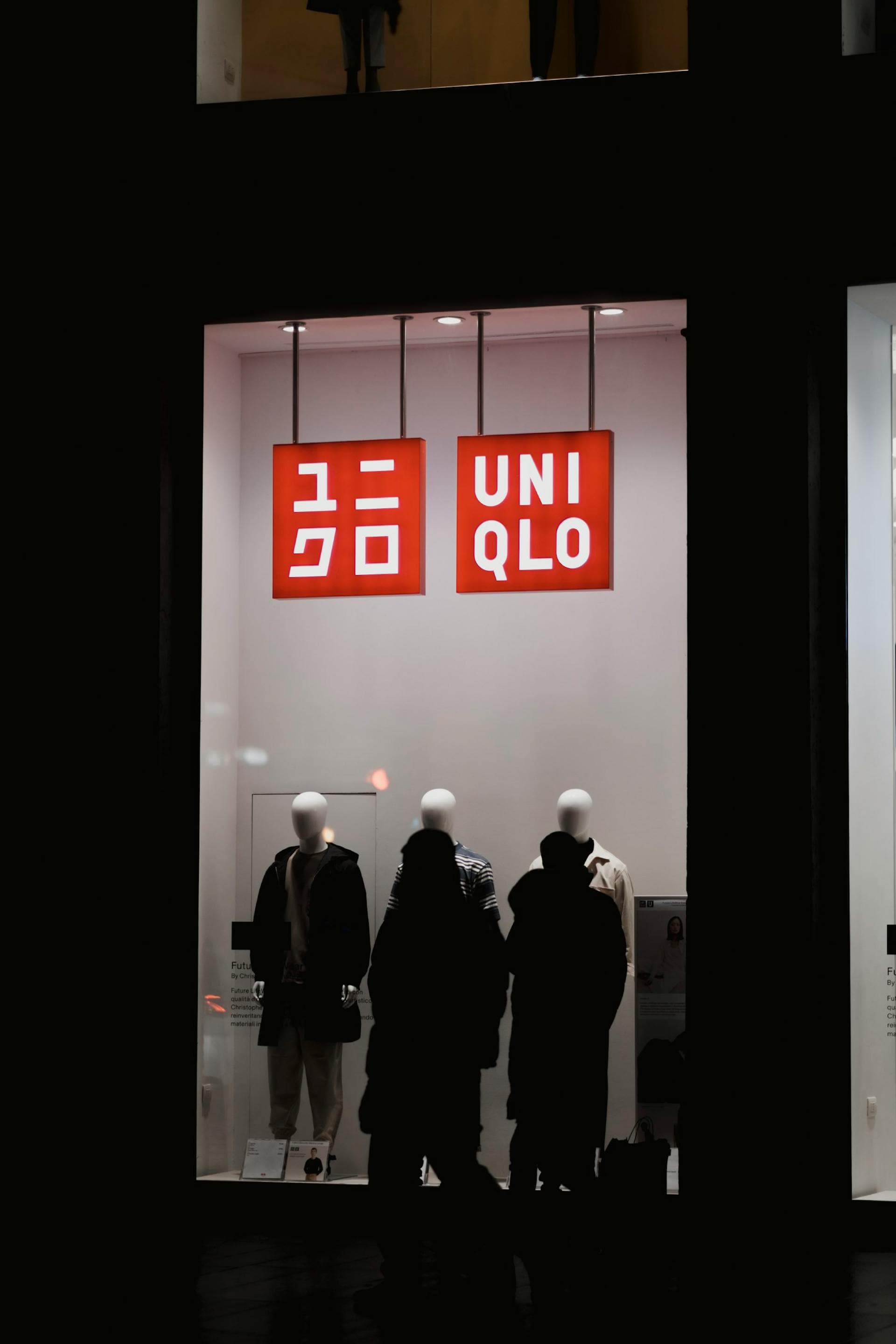 Uniqlo store window illuminated at night