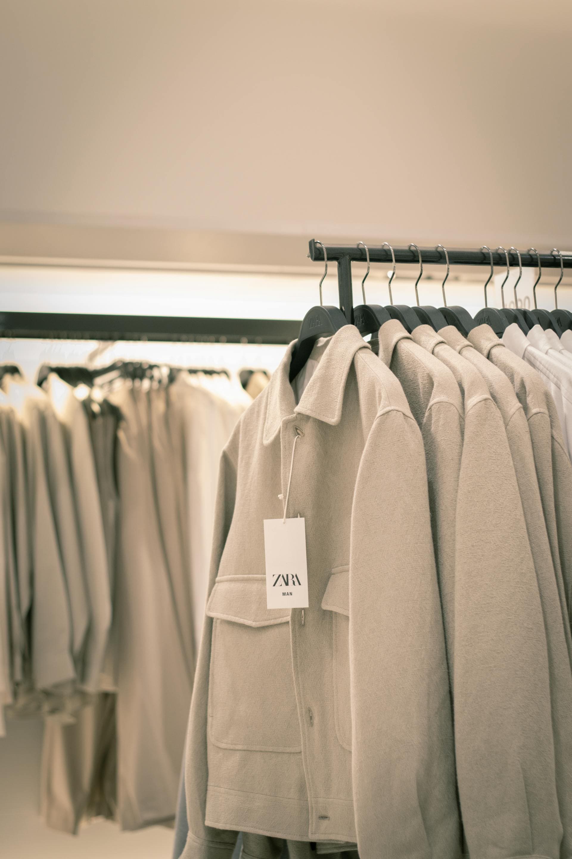 A densely packed Zara clothes rack in a store