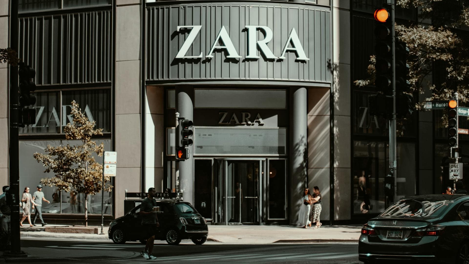 A Zara storefront lit at dusk